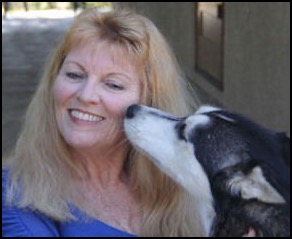Woman smiling with Siberian husky dog
